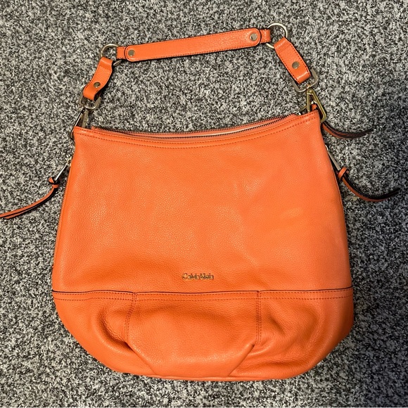Calvin Klein Handbags - Calvin Klein orange leather satchel purse